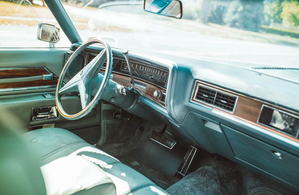 Interior of a classic Cadillac car.